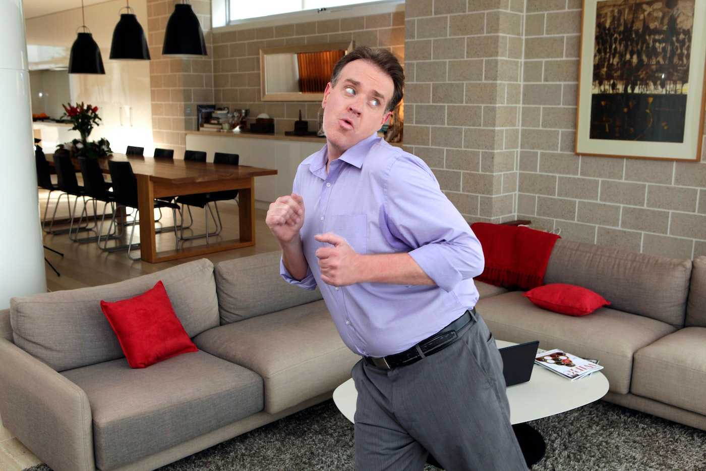 Man dancing in living room