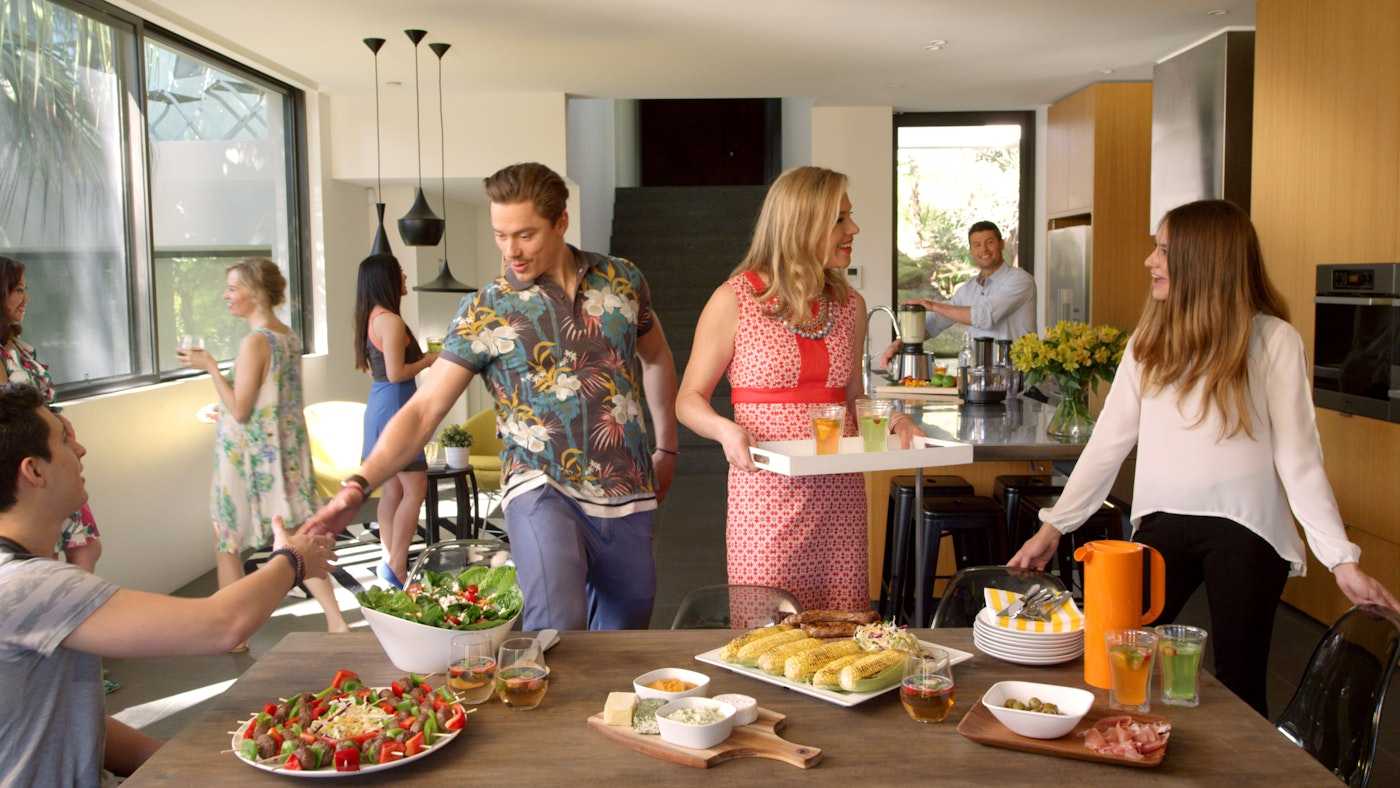 Friendly gathering around dining table