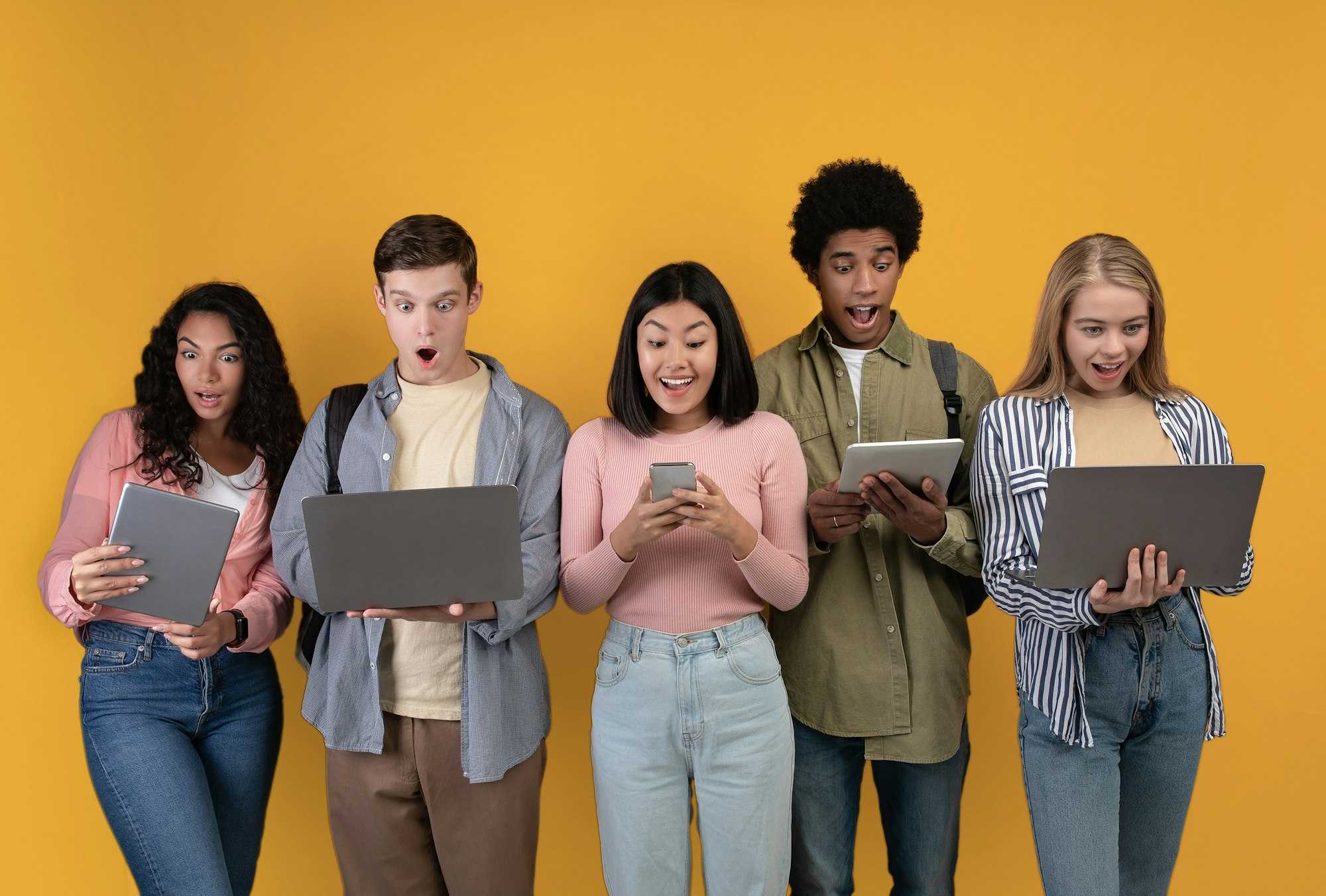 friends all standing next to each other but immersed in screens not each other