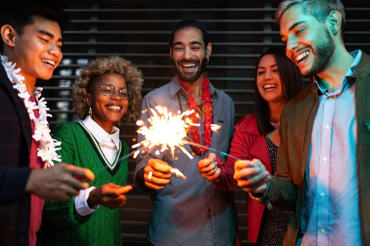 Young Professionals Celebrating with Sparklers | Belong Creative