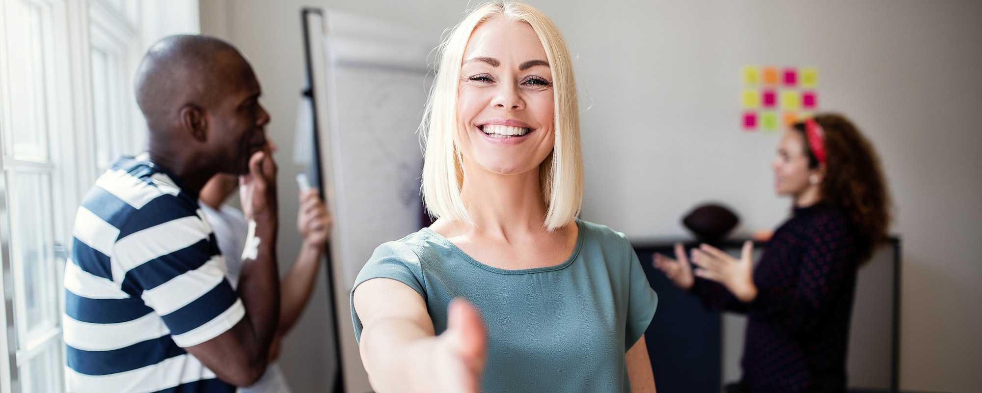 Welcoming woman with hand help out