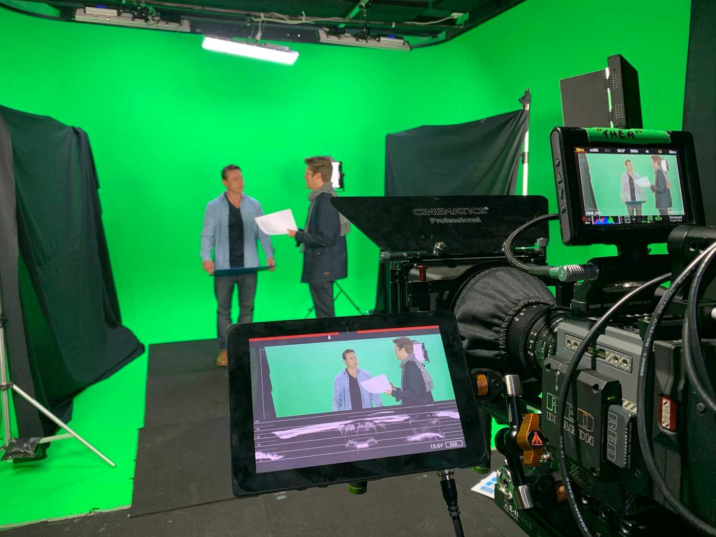 Green screen film set with people talking