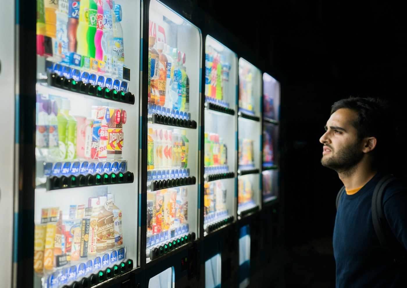 Man looking at vending machines