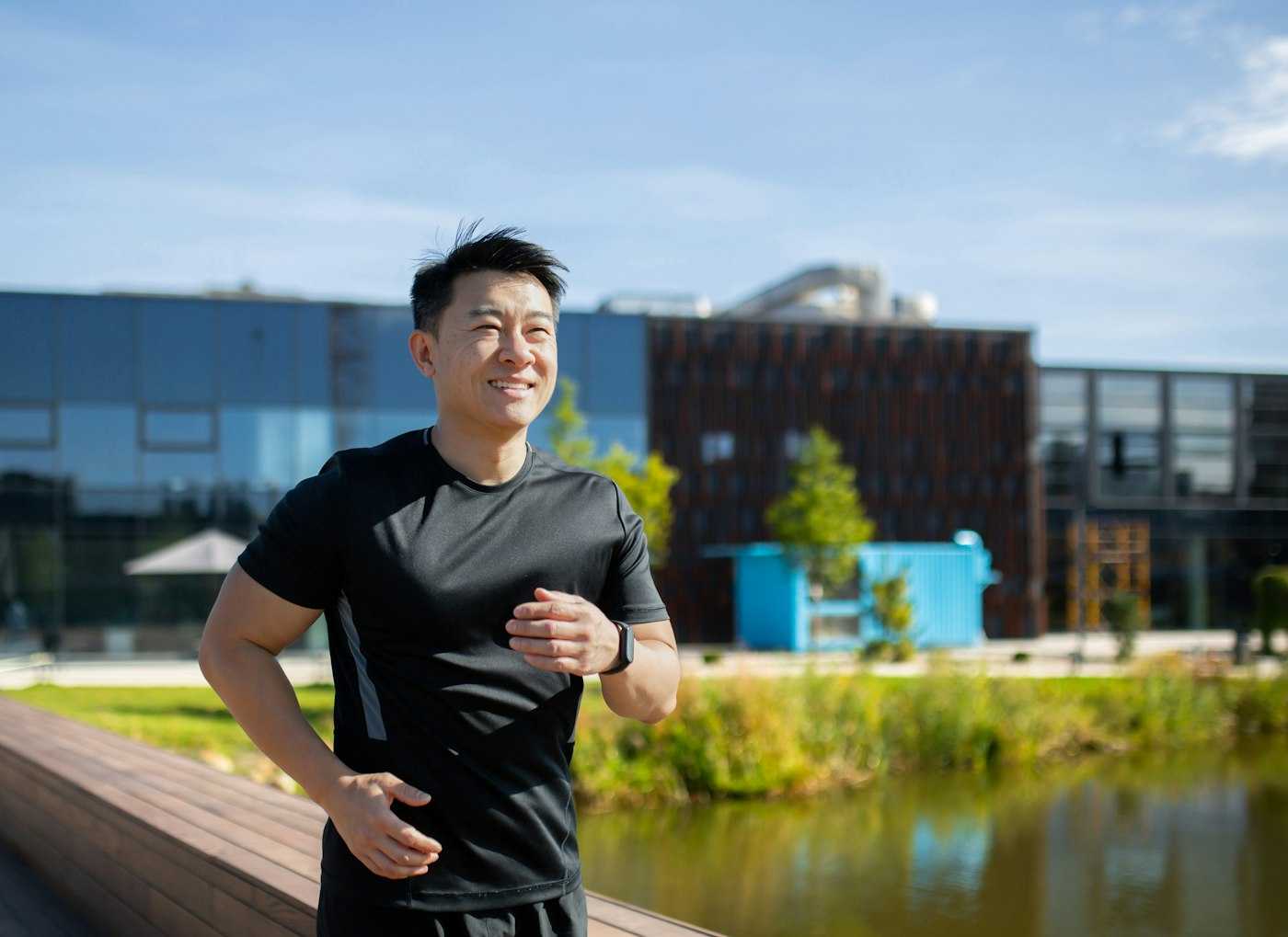 Asian man running on a lunch break